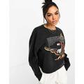 Tommy Jeans relaxed cropped vintage eagle crew neck sweatshirt in black