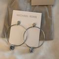 Michael Kors Jewelry | Michael Kors Silver Tone Brass Hoop Earrings With Round Mk Charm & Crystal Nwt | Color: Silver | Size: Os