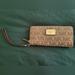 Michael Kors Bags | Michael Kors Light Brown Combo Cloth Clutch Wristlet Wallet With Strap | Color: Brown/Tan | Size: Os