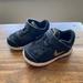 Nike Shoes | Nike Flex Baby Shoes Black And Gold, Size 5c | Color: Black/Gold | Size: 5bb