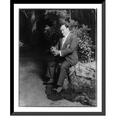 Historic Framed Print [Enrico Caruso 1873-1921 full-length portrait seated facing left holding flower] 17-7/8 x 21-7/8