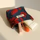 Petit sac cosmétique portable pour femme rouge doux petite serviette hygiénique sac de rangement