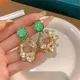 Boucles d'oreilles en émail sur fleurs pour femmes perle de cristal vert évider brillant boucle