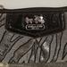 Coach Bags | Coach Black & Silver Shimmer Zebra Wristlet | Color: Black/Silver | Size: Os