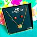 Coach Jewelry | Coach L Gold Tone Metal Rainbow Crystal Round Pendant Necklace Red Stud | Color: Gold/Red | Size: Os