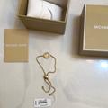 Michael Kors Jewelry | Michael Kors Gold Tone Slider Bracelet Open Frame Circle & Mk Logo Crystal Nwt | Color: Gold | Size: Os