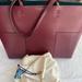 Tory Burch Bags | Burgundy Tory Burch Tote With Matching Detachable Clutch | Color: Purple/Red | Size: Os
