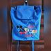 Disney Bags | Disney Parks Blue Nylon Drawstring Backpack 1990s Vtg Disney Unisex Backpack Bag | Color: Blue | Size: 13.5 Long X 14.5 Wide