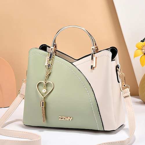 marineblaue und rosa Handtasche für Damen mit Herzquastenanhänger – elegante Umhängetasche und Tragetasche aus Kunstleder für den täglichen Gebrauch