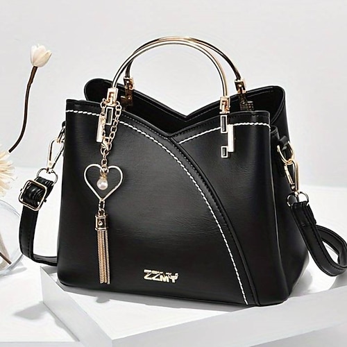 marineblaue und rosa Handtasche für Damen mit Herzquastenanhänger – elegante Umhängetasche und Tragetasche aus Kunstleder für den täglichen Gebrauch