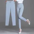 Pantaloni bianchi pantaloni Haren elastici a vita alta da donna pantaloni di seta di ghiaccio