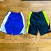 Nike Bottoms | 2 Pairs Of Nike Youth Small Shorts | Color: Black/Blue/Silver/White/Yellow | Size: Sb