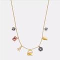 Coach Jewelry | Coach Mini Handbag Charm Necklace | Color: Gold | Size: Os