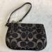 Coach Bags | Coach Signature Pattern Small Wristlet. Colors Are Black, Silver And Gray | Color: Black/Silver | Size: 6” W X 4.5 H X .5 D