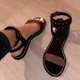 Sandales gladiateur en cuir pour femmes chaussures d'été plates talon bas bout ouvert lanière à