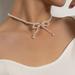 Anthropologie Jewelry | Elegant Pearl Bowknot Necklace Bow Choker Ribbon | Color: Silver/White | Size: Os