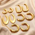 Neue Vintage glänzende wasserdichte Edelstahl Huggie Ohrringe für Frauen Mädchen 18 Karat vergoldet