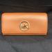 Michael Kors Bags | Michael Kors Fulton Carryall Wallet (Luggage) | Color: Brown | Size: 7.5''W X 4.5''H X 1''D