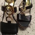 Michael Kors Shoes | Michael Kors Nwot Black Leather Wedges With Gold Logo-Size 8m | Color: Black/Gold | Size: 8