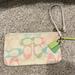 Coach Bags | Coach Signature Wristlet Slightly Used. No Tears Or Scratches | Color: Cream | Size: Small Wristlet Fits Iphone 12 Pro Max With Space