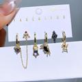 Disney Jewelry | Disney Villains Maleficent 14k Gold Plated Mismatch Huggie Hoop Earrings Set | Color: Gold/Purple | Size: Os