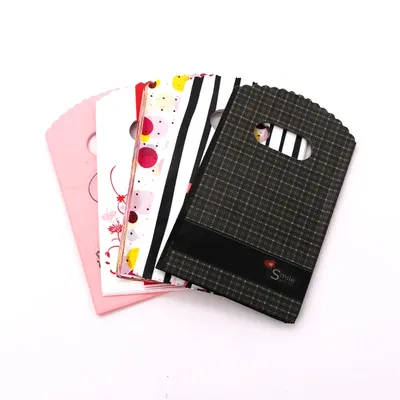 50Pcs/Lot Multi Designs Small Plastic Bag 9x15cm Boutique Gift Bag With Handles Nice Charms Earrings