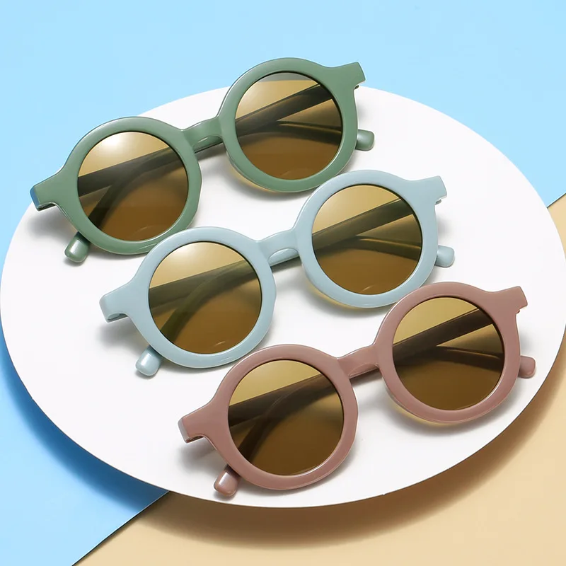 Neue Modische Runde Rahmen-Sonnenbrille in Bonbonfarben für Babys Retro Einfarbiger Schutz Runde Praktische Brille für Kinder Image