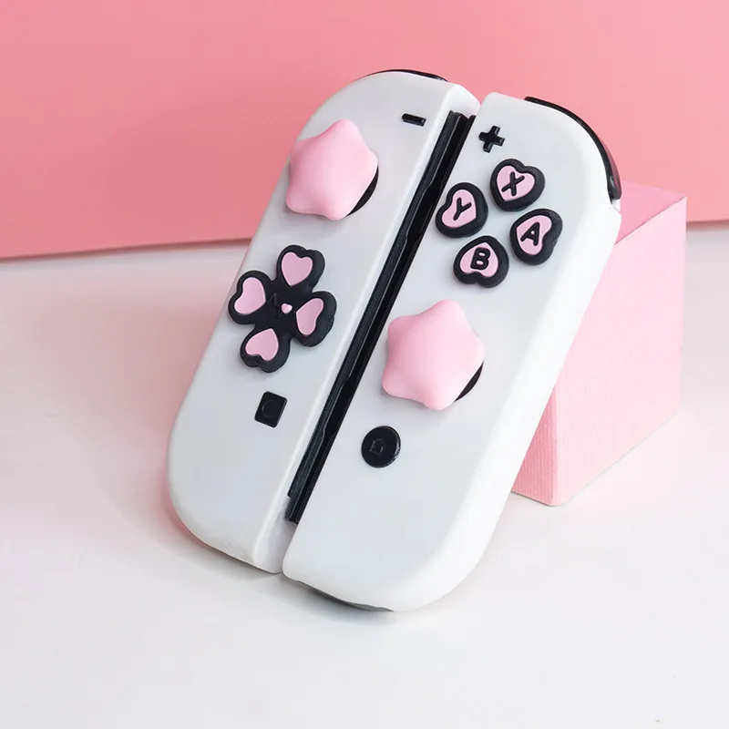 Süße Cross D-Pad Button Caps Silikon Daumengriffe Set, ABXY Key Buttons Aufkleber Joystick Cover Caps für Nintendo Switch/OLED Image