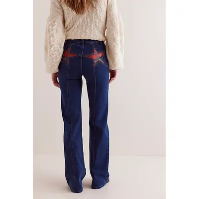 We The Free Firecracker Flare Jeans at Free People in Holiday Tartan, Size: 25