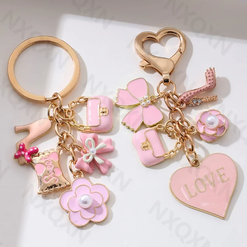 Hübscher rosa Herz-Blumen-Schleife-Knoten-Taschen-Emaille-Schlüsselanhänger, süßer modischer Schlüsselanhänger für Frauen und Mädchen, handgefertigter Geburtstagsgeschenk-Schmuck Image