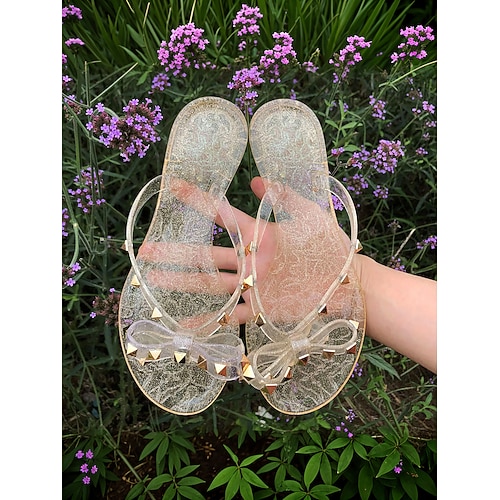 Schwarze Flip-Flops mit Nieten und Schleife für Damen – schicke Strandsandalen mit bequemer flacher Sohle für den lässigen Sommerlook Image