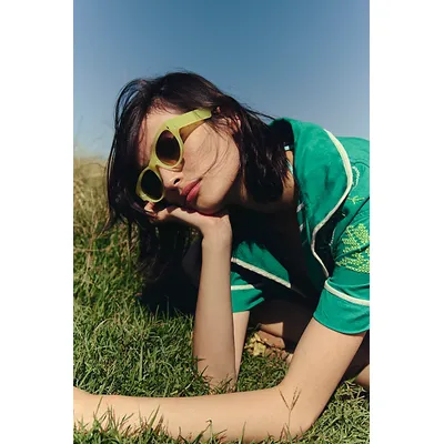 Naya Round Sunglasses at Free People in Lemon
