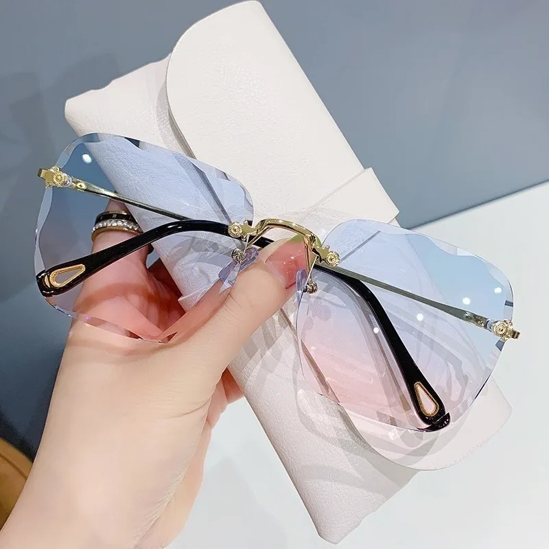 Randlose Sonnenbrille für Damen, Ozeanlinse, unregelmäßiger Rahmen, UV-Schutz Image