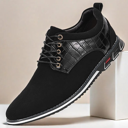 Schwarze Herrenschuhe mit Schnürung und Krokodilmuster, elegant und stilvoll für geschäftliche und gesellschaftliche Anlässe Image