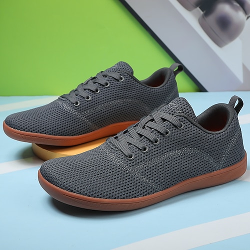 Weiße Strick-Sneaker für Herren mit leuchtend orangefarbener Sohle – atmungsaktive Freizeitschuhe zum Laufen, für Outdoor-Aktivitäten und den urbanen Style Image