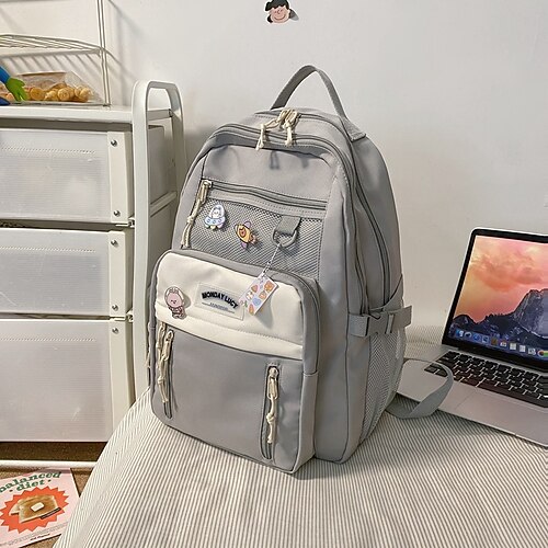 Zaino viola estetico per ragazze con portachiavi di peluche a forma di coniglietto e tasca a rete – zaino scolastico leggero e impermeabile per studenti adolescenti e per l'uso quotidiano