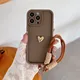 Custodia morbida per telefono in silicone 3D Gold Heart Love per iPhone 16 Pro Max 15 14 13 12 11 Custodia protettiva per cinturino da polso con corda
