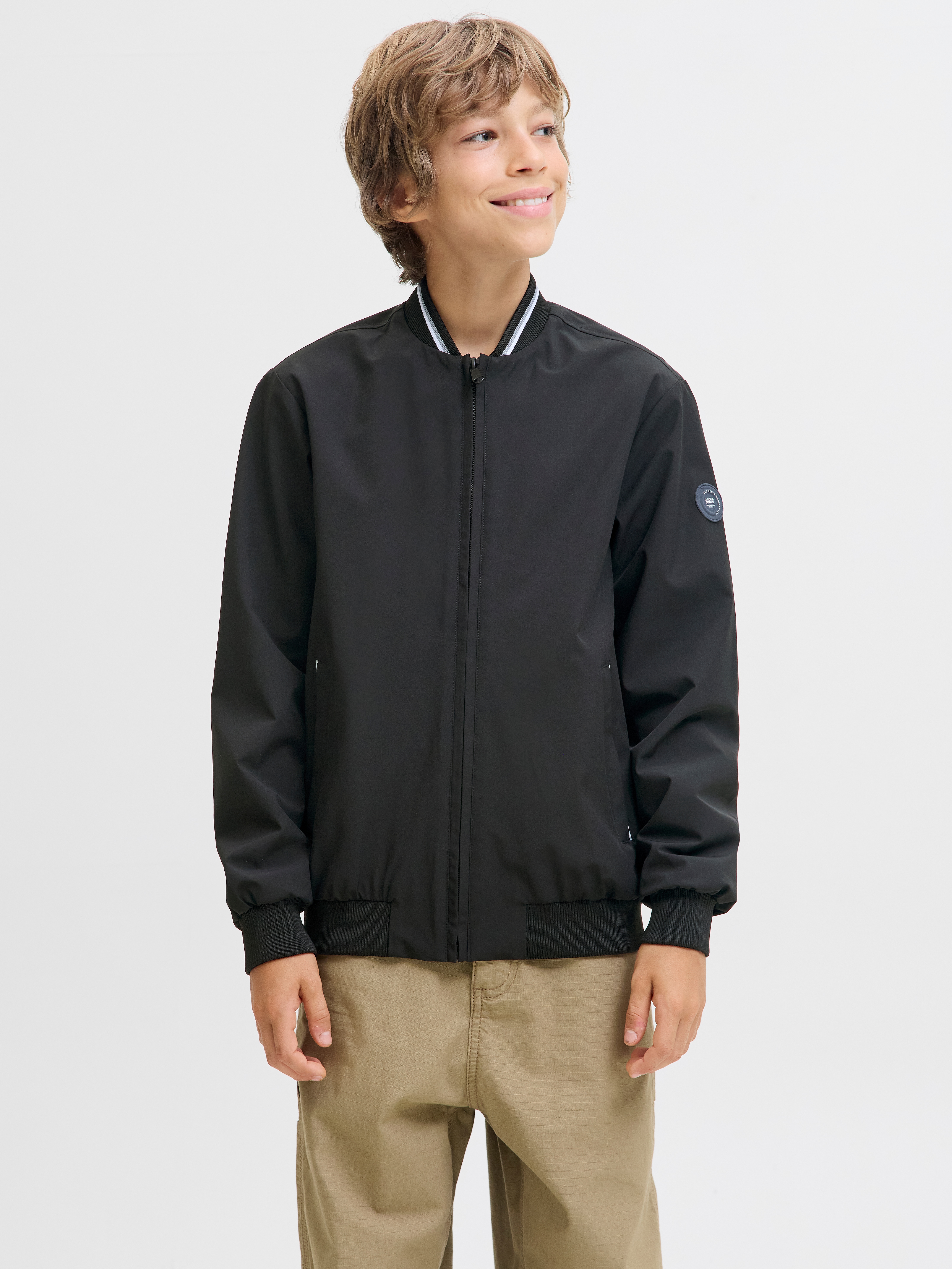 Bomberjacke JACK & JONES JUNIOR "JJBROOK BOMBER JNR", Jungen, Gr. 164, schwarz (schwarz detail:lining: schwarz), Web, Obermaterial: 90% Polyester, 10% Elasthan, unifarben, regular fit normal, Jacken Bomberjacke