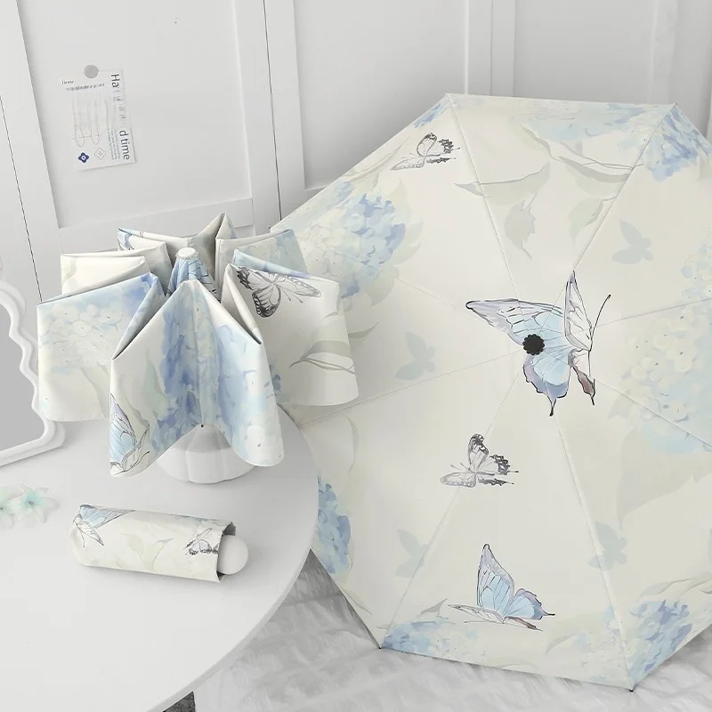 Kleiner, frischer Schmetterlings-Regenschirm, Sonne, Regen, doppelter Verwendungszweck, dreifach gefalteter Regenschirm mit acht Knochen, sonnenbeständig, Anti-UV-Sonnenschutz mit schwarzem Kleber Image