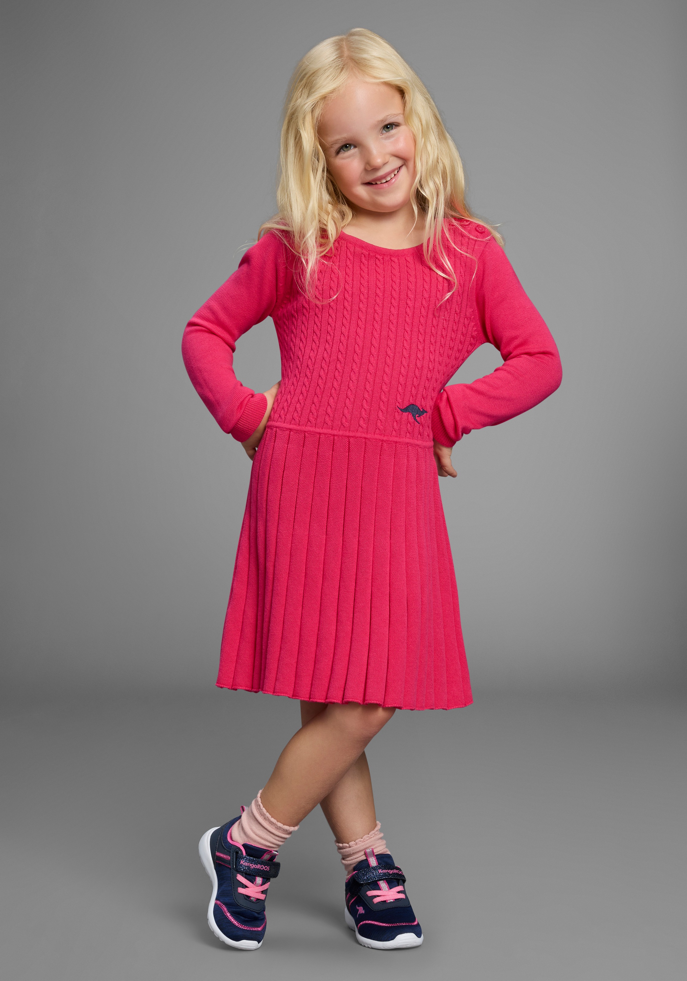 Strickkleid KANGAROOS "Strickkleid mit Faltenrock", Mädchen, Gr. 116/122, N-Gr, pink, Feinstrick, Obermaterial: 100% Baumwolle, Zopfmuster, festlich, figurumspielend kurz, Rundhals, Bündchen, Kleider, Niedliches Strickkleid mit Zopfmuster für kleine... Image