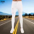 Jeans Wihte Uomo Elastico in vita Jeans skinny 2023 Pantaloni in denim strappati elasticizzati Streetwear Pantaloni da jogging estivi da uomo di alta qualità