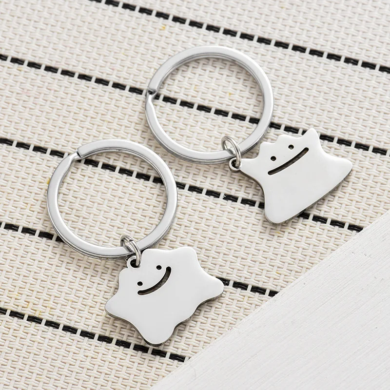 Lustiger Dito hohler Schlüsselanhänger, süßer Trend, Titanstahl, Schultasche, Autoschlüssel, Anhänger, Paar, neues Schmuckstück, Freunde, Geschenk, Schlüsselanhänger Image