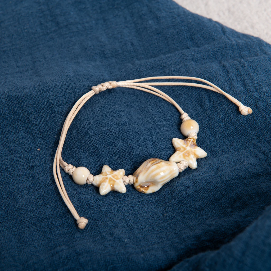 Handgefertigtes weißes Keramik-Muschel- und Sternperlenarmband, verstellbare Wachsschnur, Küstenstrand-Schmuck für Paare und Freunde Image