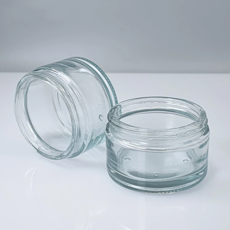 Commercio all'ingrosso 200g bocca larga vetro cosmetico barattolo di crema vuota per il viso nero coperchio dorato tappo di plastica per la cura della pelle crema per il viso