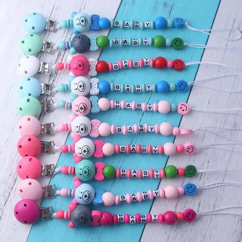 5 Stück/Set Niedliche Cartoon-Baby-Schnullerclips in Verschiedenen Farben mit Holz-Beißperlen, Schnullerhalter für Jungen und Mädchen Image