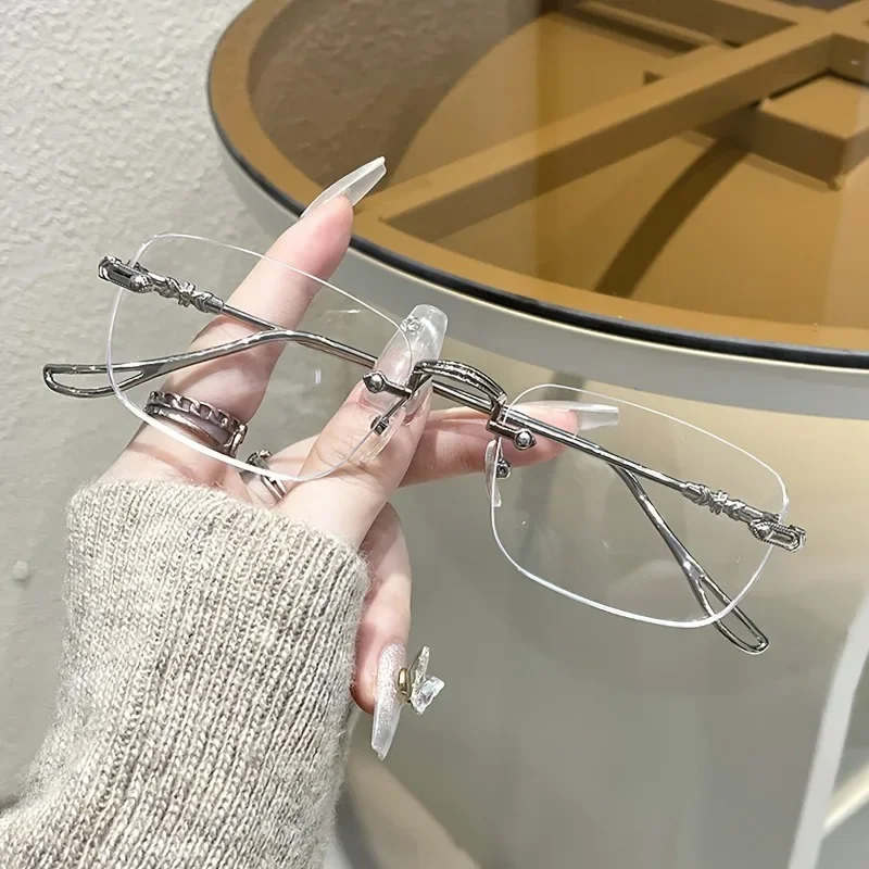 Elegante randlose rechteckige Damenbrille mit blau lichtblockierendem Metallrahmen Image