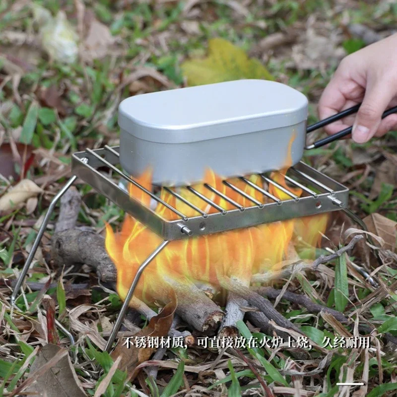 Klappbarer tragbarer Outdoor-Grillrost aus Edelstahl, Grillplatte, Kesselständer, Mini-Grill mit gestreiftem Gitter für Camping und Reisen Image
