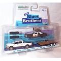 greenlight entertainment hollywood hitch & tow black white the blue brothers 1974 dodge monaco bluesmobile 2015 RAM 1500 & flatbed trailer truck 2 piece set 1.64 scale diecast model