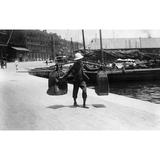 China: Hong Kong C1900. /Na Chinese Worker Carrying Two Heavy Sacks On Pole Across His Shoulders On The Waterfront In Hong Kong China. Photograph C1900. Poster Print by Granger Collection