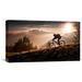 Global Gallery 'Golden Hour Biking' by Sandi Bertoncelj Photographic Print on Wrapped Canvas in Black/Gray/Orange | 12.8 H x 22 W x 1.5 D in | Wayfair